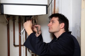 Plumbers Heat engineer Liability Insurance Plumber working on a boiler